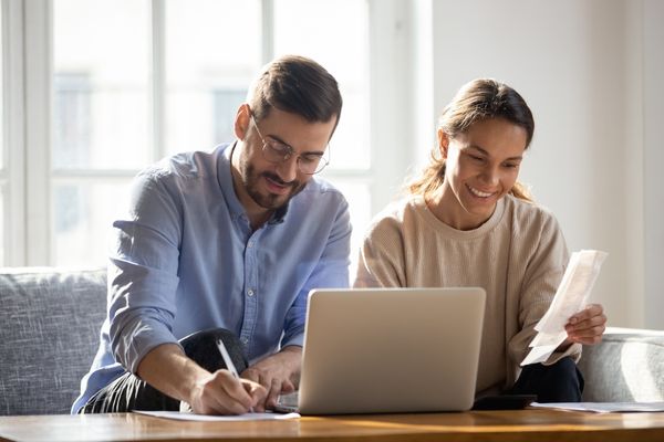 happy couple researching financing options