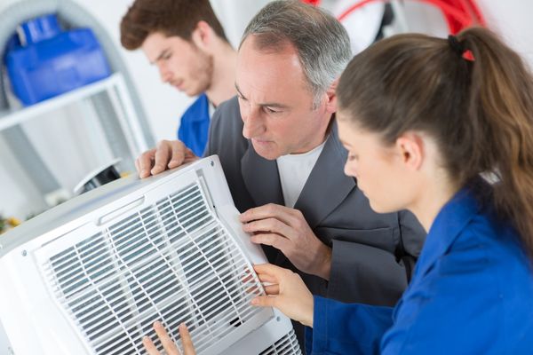 HVAC team installing new unit